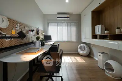 Modern study room with dual workstations and ample natural light