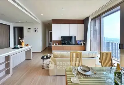 Modern open-plan living room with dining area and balcony view