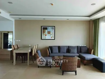 Spacious living room with modern wicker furniture and elegant decor