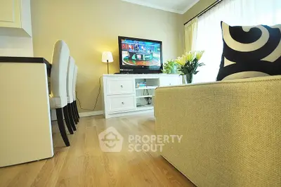 Modern living room with stylish decor and flat-screen TV