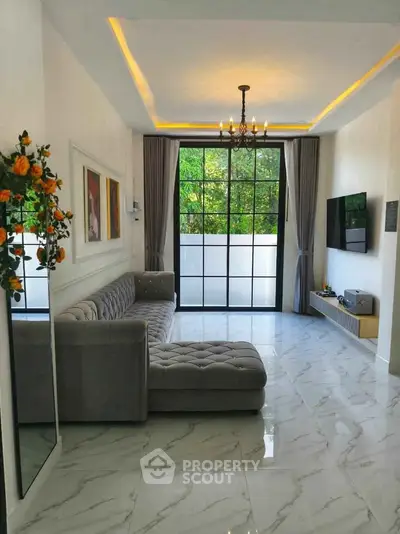 Elegant living room with large windows and modern decor