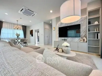 Luxurious modern living room with elegant decor and open dining area