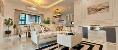 Luxurious open-plan living room with elegant decor and modern kitchen