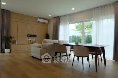 Spacious modern living room with elegant dining area and large windows