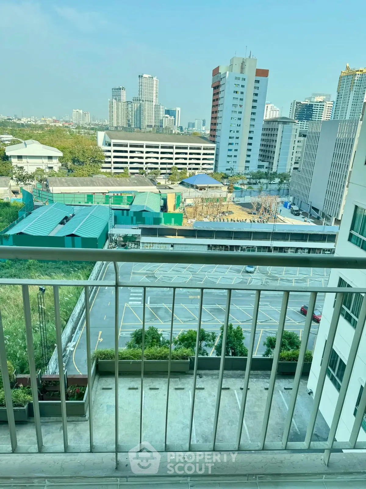 Stunning cityscape view from a high-rise balcony, perfect for urban living enthusiasts.