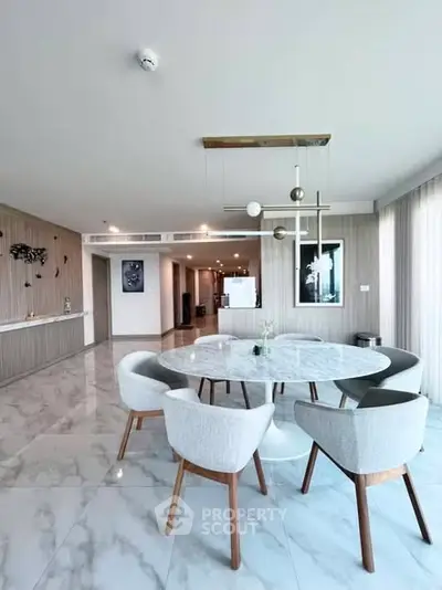 Luxurious modern living room with elegant dining area and marble flooring