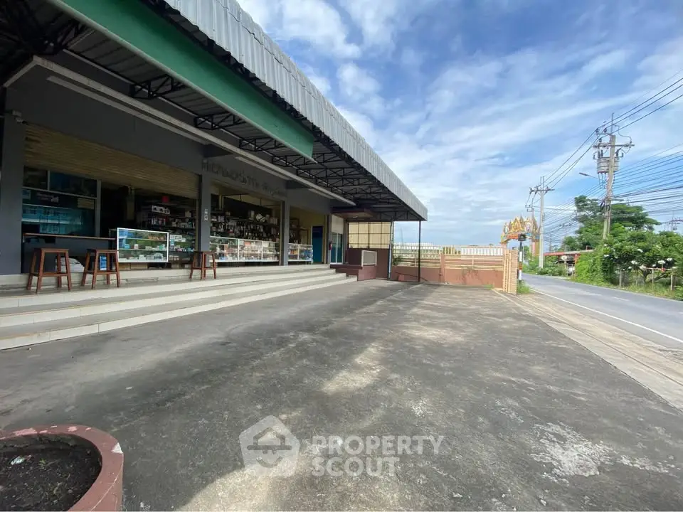 Commercial property with spacious parking area and road access