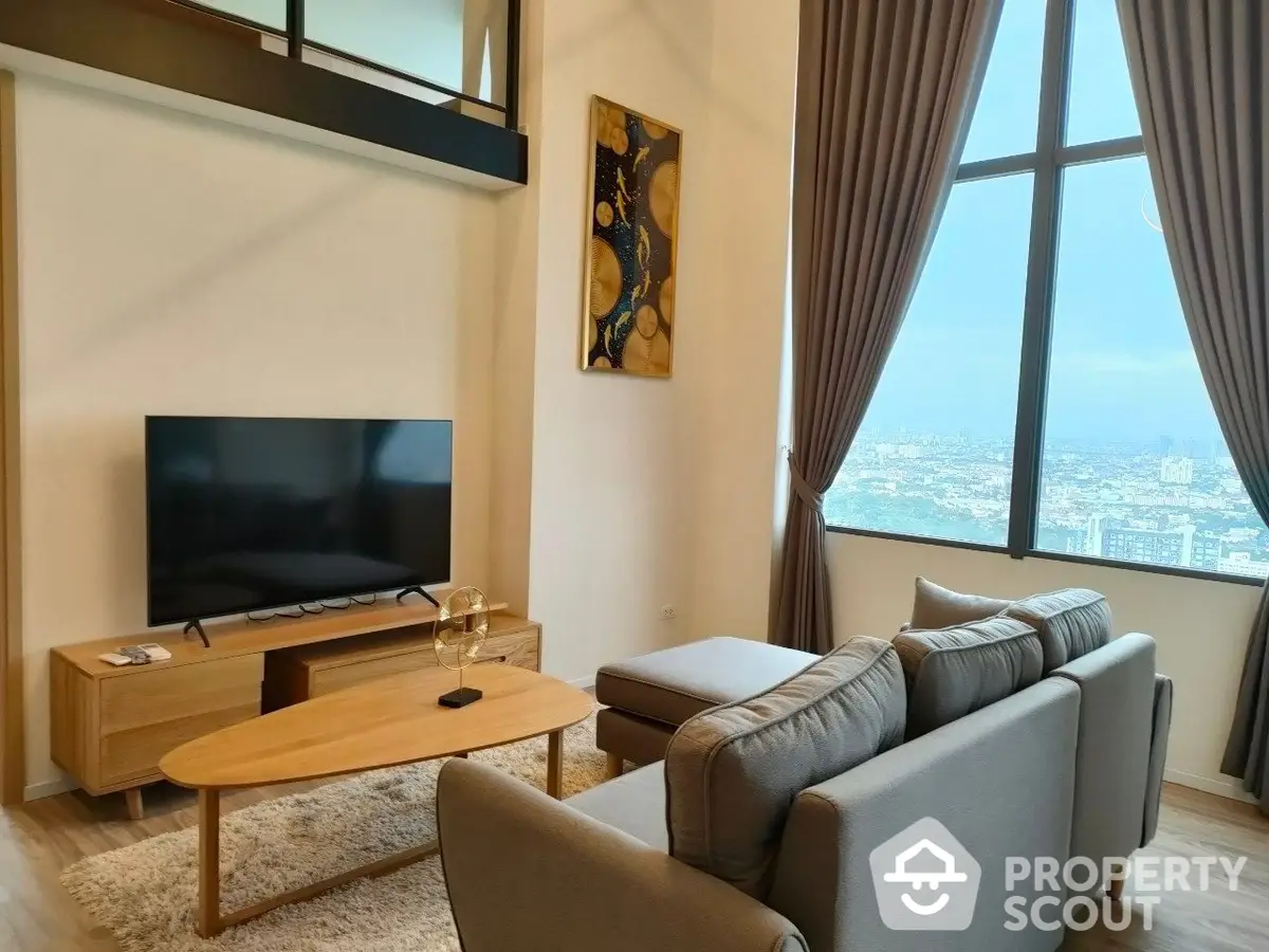 High-rise living room with panoramic city views, modern furnishings, and abundant natural light, perfect for urban living.