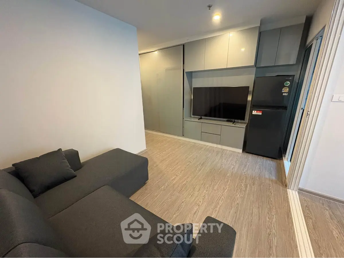 Modern living room with sleek furniture and built-in entertainment center