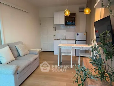 Cozy modern living room with kitchenette and stylish lighting