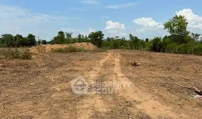 Expansive vacant land with clear skies, ideal for development opportunities.