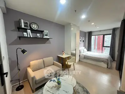 Modern studio apartment with cozy living area and stylish decor