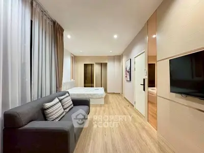 Modern studio apartment with cozy living area and stylish decor