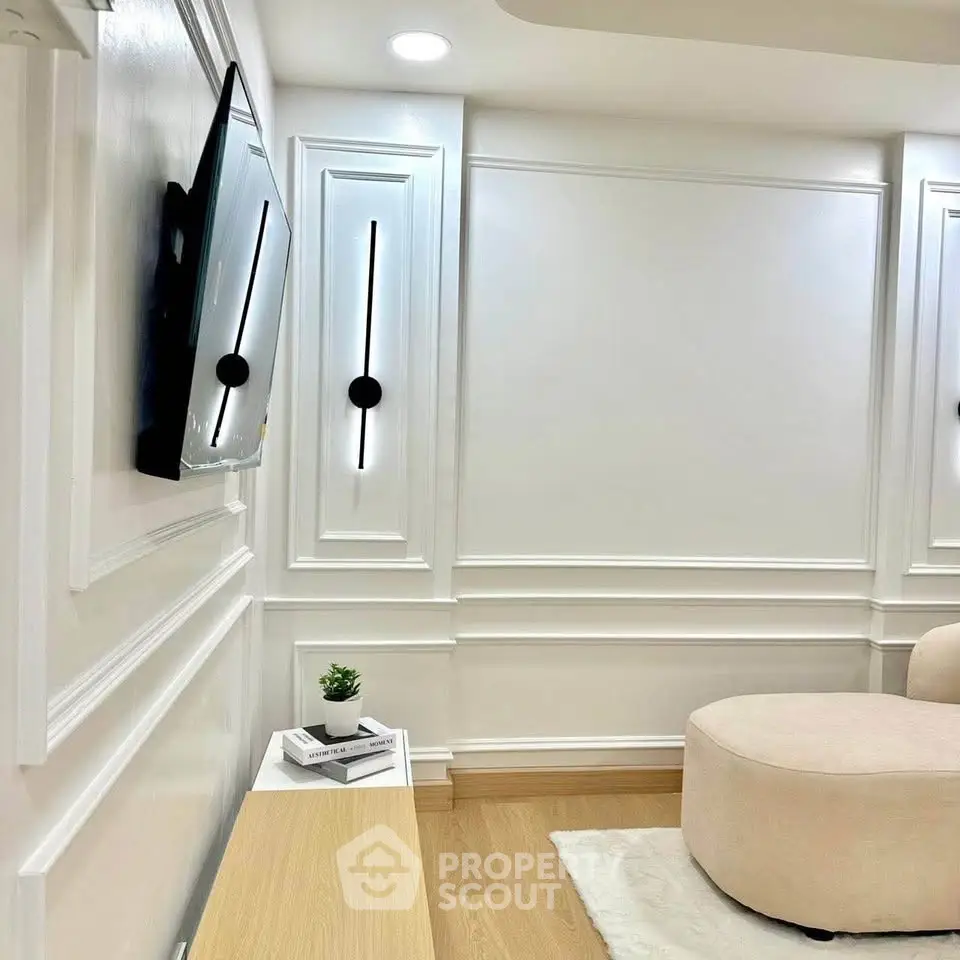 Elegant modern living room with sleek wall design and mounted TV