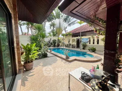 Luxurious tropical villa with private pool and lush garden, perfect for relaxation and entertaining.