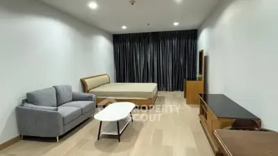 Spacious modern studio apartment with elegant furnishings and cozy ambiance