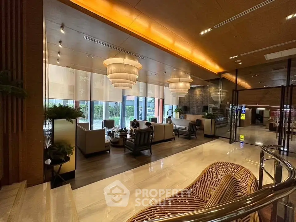 Luxurious lobby with elegant seating and modern lighting in upscale building
