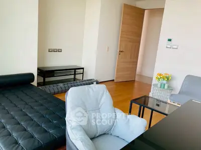 Modern living room with stylish furniture and wooden flooring
