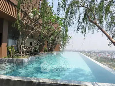Luxurious rooftop infinity pool with stunning city view and lush greenery