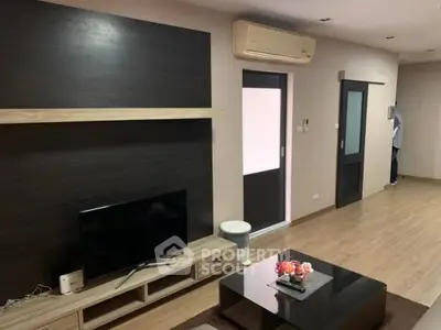 Modern living room with sleek TV unit and air conditioning