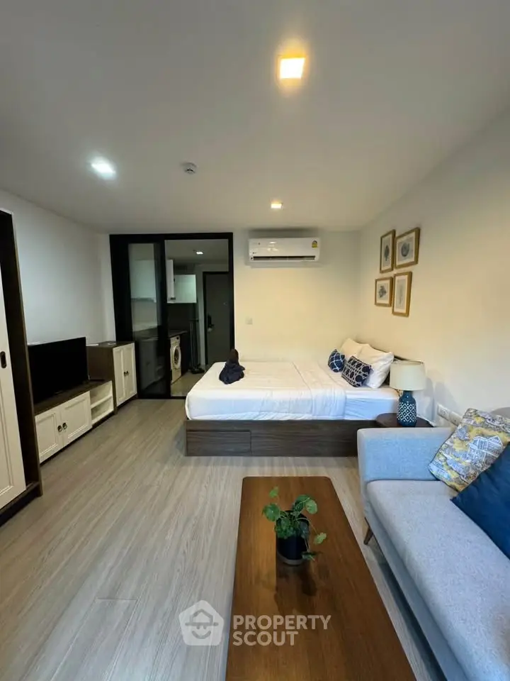 Modern studio apartment with cozy living area and stylish decor