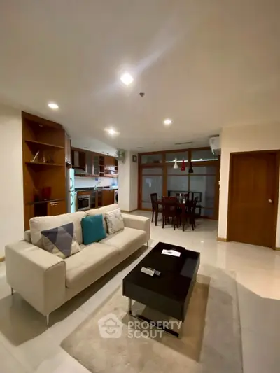 Spacious open-plan living room with modern kitchen and dining area