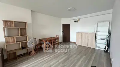 Spacious living room with modern wooden furniture and sleek flooring