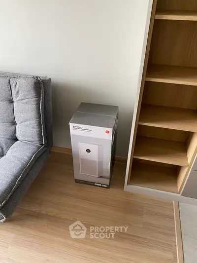 Modern living room with stylish furniture and sleek shelving unit