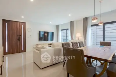 Modern living room with elegant dining area and stylish decor