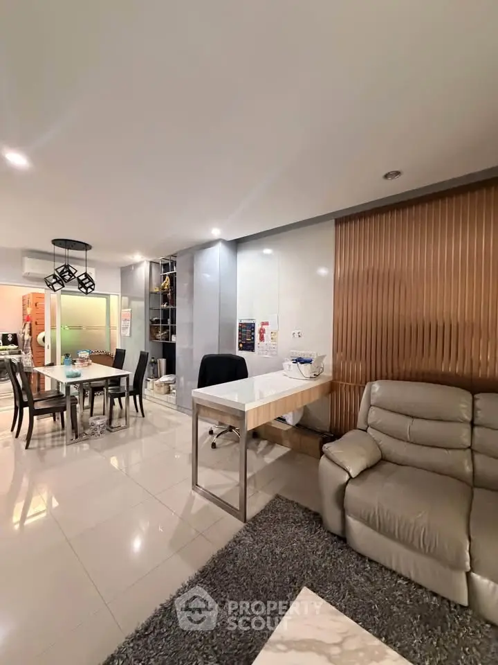 Spacious modern living room with elegant dining area and stylish decor