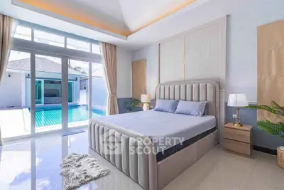 Luxurious bedroom with pool view, elegant decor, and natural light in a modern home.