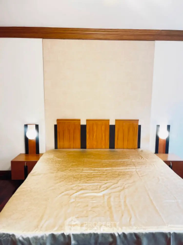 Elegant bedroom with modern wooden headboard and ambient lighting