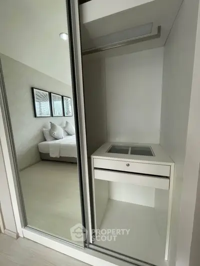 Modern bedroom with sleek built-in wardrobe and stylish decor