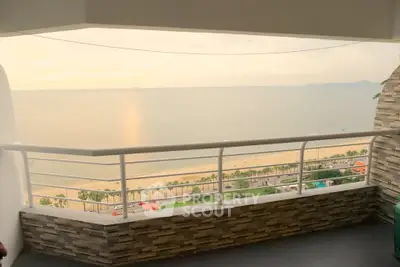 Stunning beachfront balcony with panoramic ocean views and modern railing.