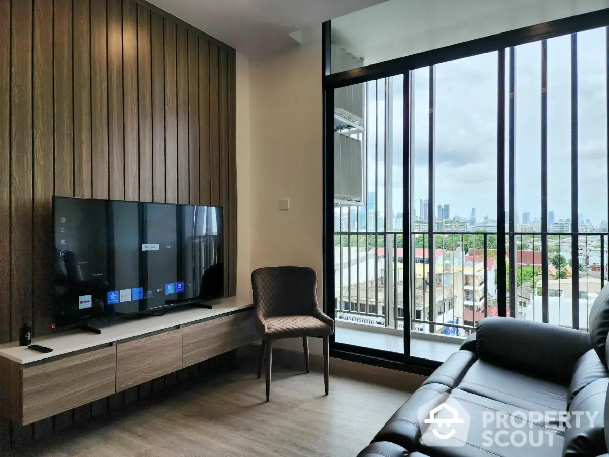 Modern living room with large windows and city view