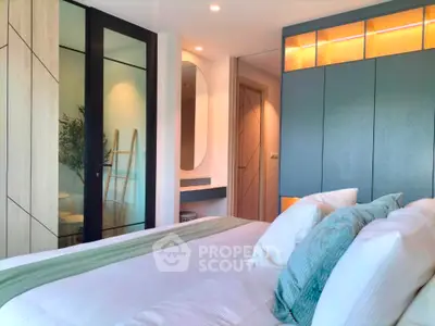 Modern bedroom with stylish decor and ample natural light