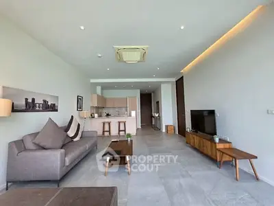 Spacious modern living room with open kitchen and stylish furniture