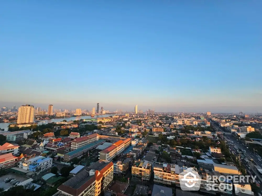 Breathtaking panoramic cityscape at dusk, showcasing a vibrant urban horizon with a blend of modern high-rises and traditional buildings.