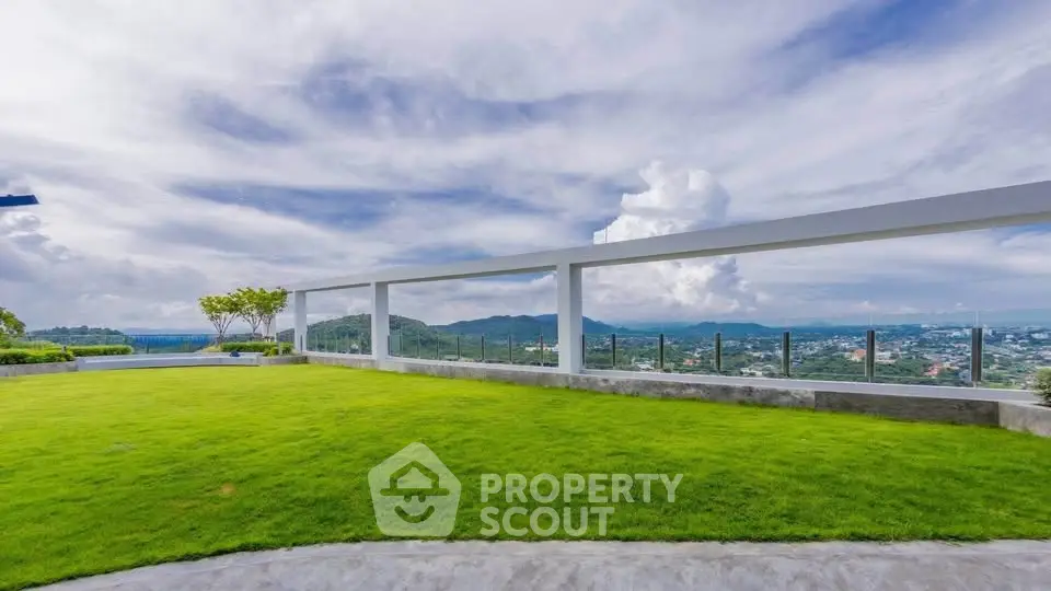 Stunning rooftop garden with panoramic city and mountain views, perfect for relaxation and entertainment.