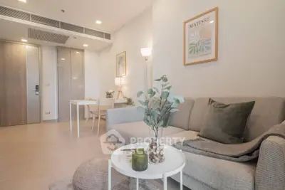 Modern living room with stylish decor and cozy seating area in a contemporary apartment.