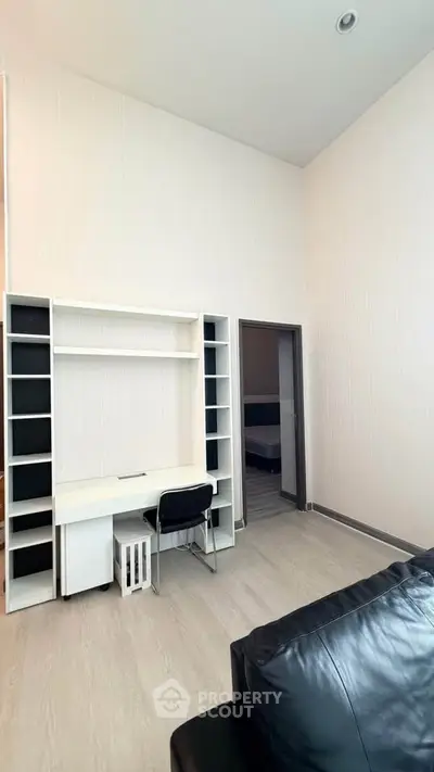 Modern study area with sleek desk and chair in a stylish apartment