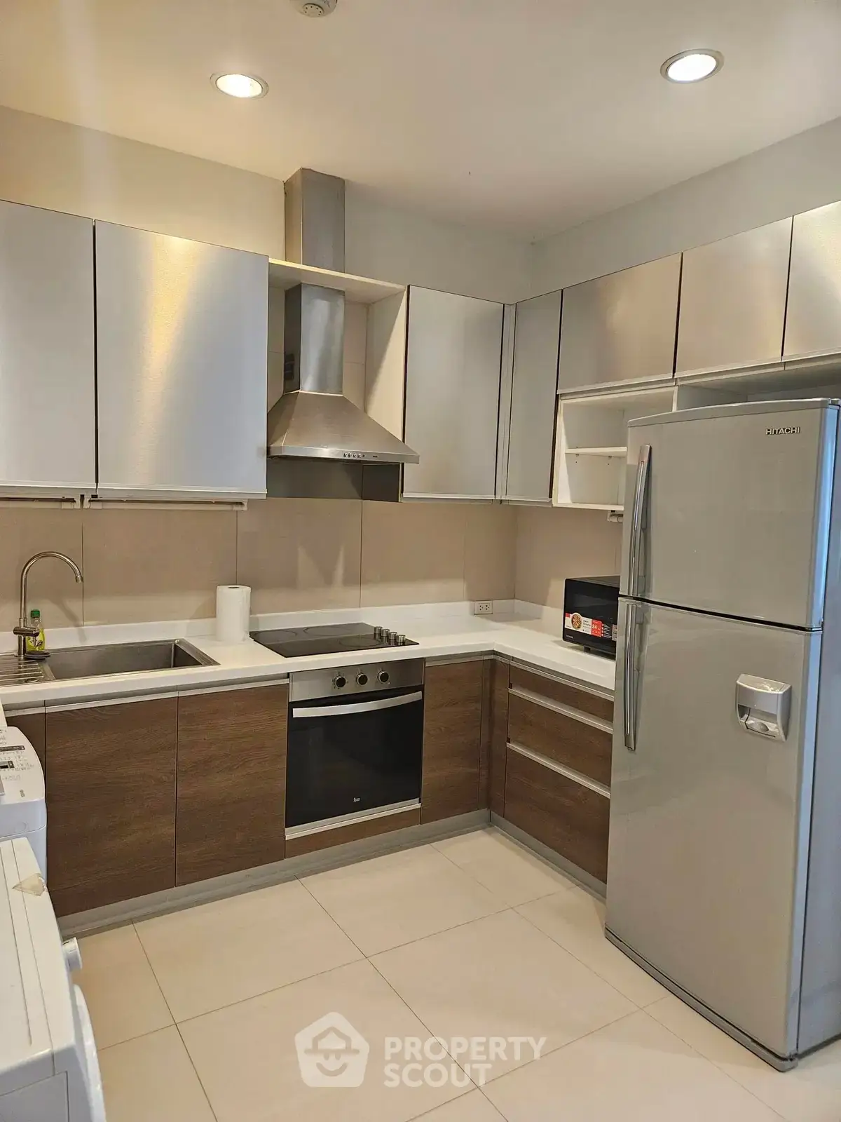 Modern kitchen with sleek cabinets, stainless steel appliances, and elegant design.