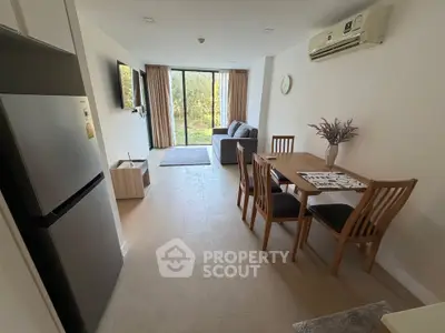 Modern open-plan living room with dining area and garden view