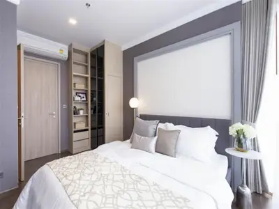 Luxurious bedroom with elegant decor and ample natural light