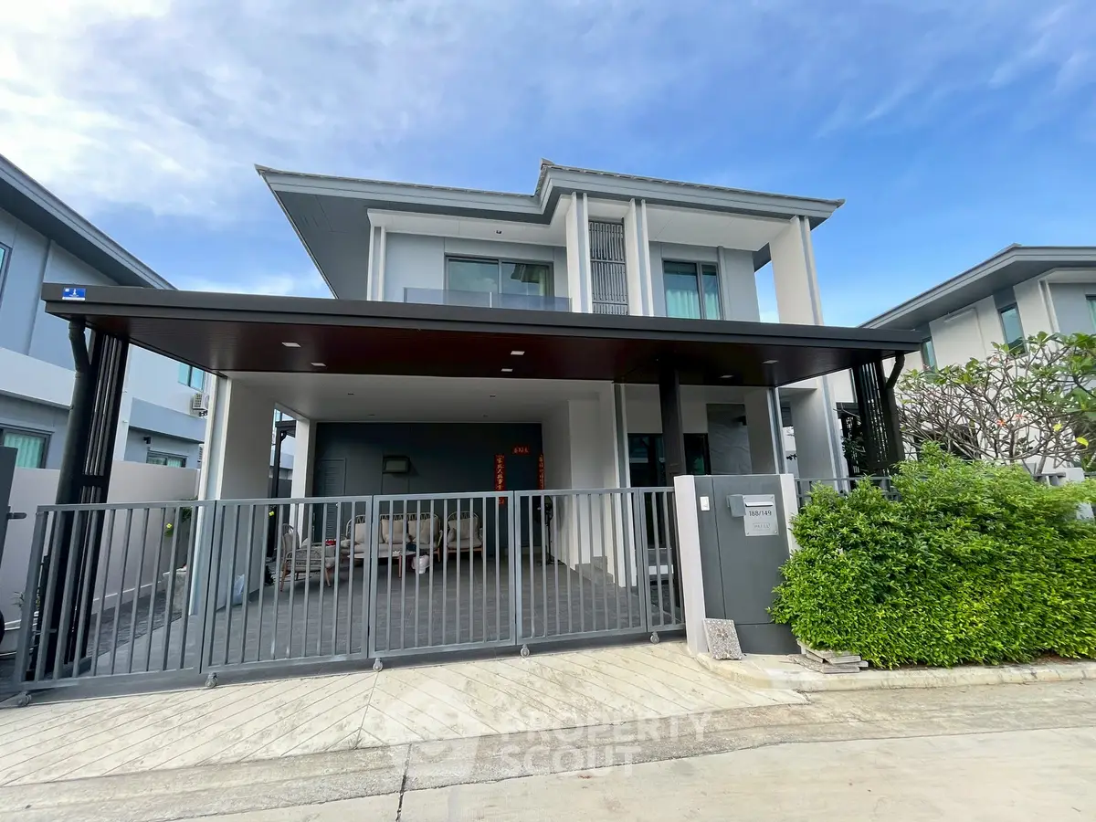 Modern two-story house with sleek design and spacious driveway
