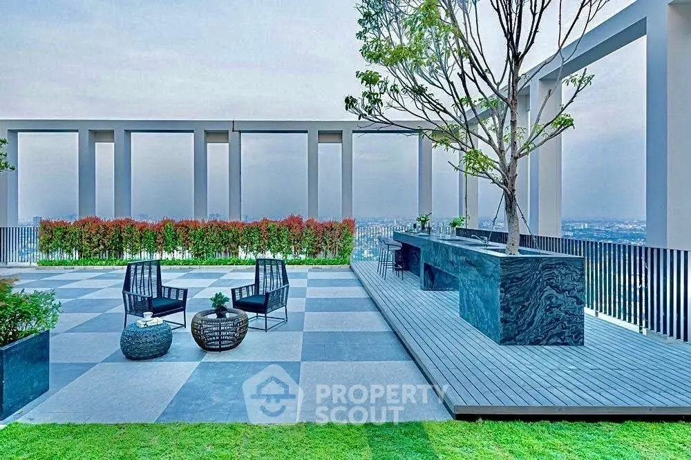 Stunning rooftop terrace with modern seating and panoramic city views.