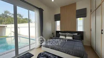 Luxurious bedroom with pool view and modern decor