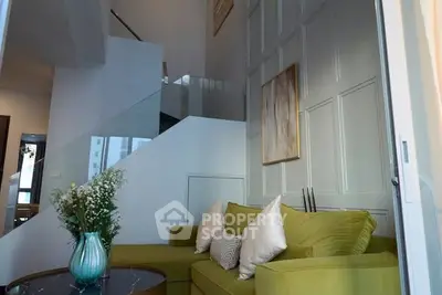 Stylish living room with modern decor and vibrant green sofa