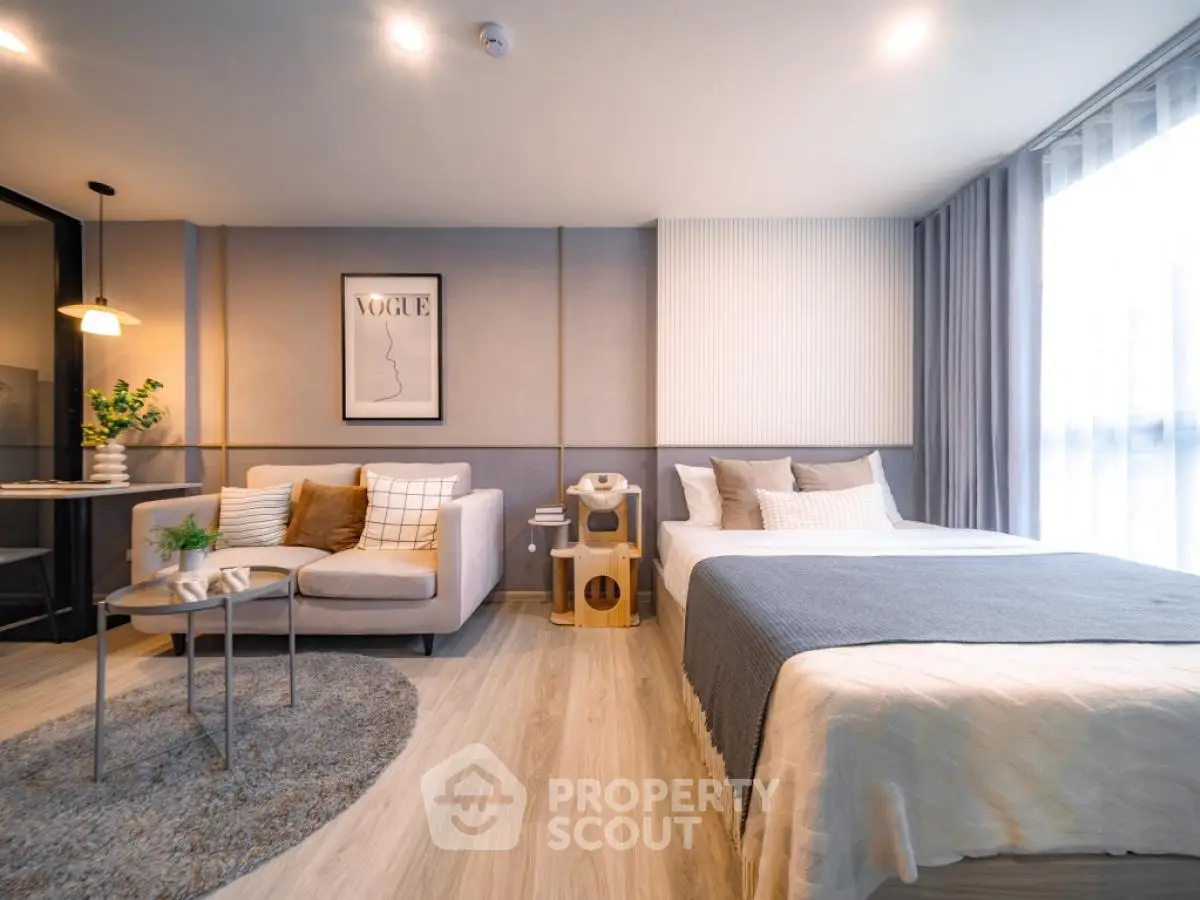 Modern studio apartment with cozy living area and stylish decor