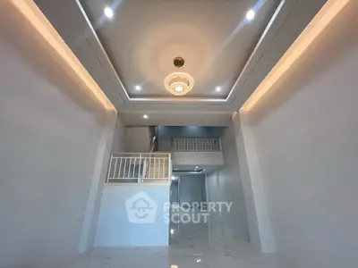 Spacious modern interior with high ceilings and elegant lighting, perfect for luxury living.